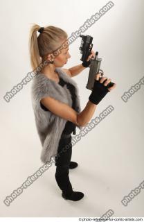 15 2018 01 NIKOL STANDING POSE WITH TWO GUNS